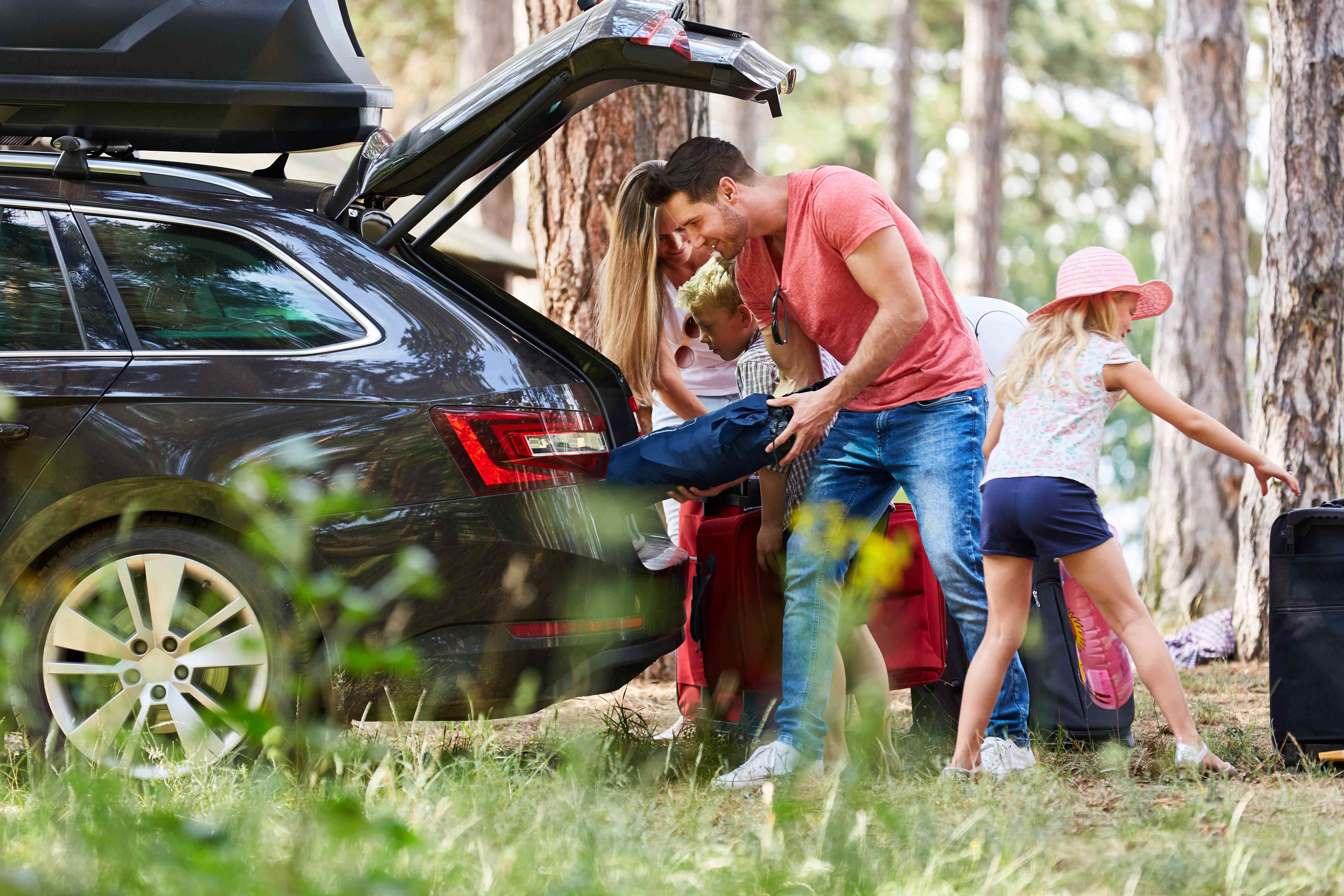 Family packing to go on caravan holiday